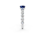 White gold Cushion Cut Blue Sapphire Prong Setting with Side Stones on a Pave Band_2