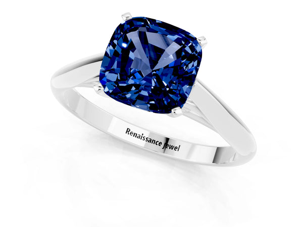 White gold Cushion Cut Blue Sapphire Solitaire Engagement Ring with Cathedral Setting and Four-Prong Mount