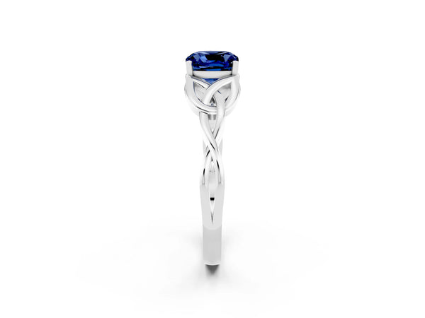 Silver Cushion Cut Blue Sapphire Solitaire Engagement Ring with Celtic Knot Band and Four-Prong Setting