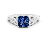 White gold Cushion Cut Blue Sapphire Solitaire Engagement Ring with Celtic Knot Band and Four-Prong Setting