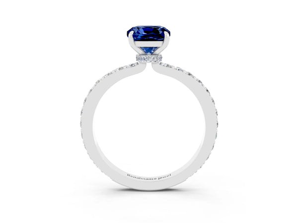 Platinum Cushion Cut Blue Sapphire Solitaire Engagement Ring with Pavé Band and Four-Prong Setting