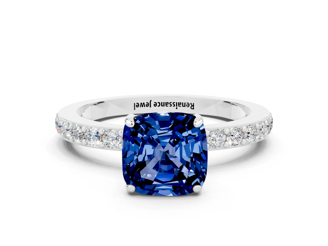 White gold Cushion Cut Blue Sapphire Solitaire Engagement Ring with Pavé Band and Four-Prong Setting