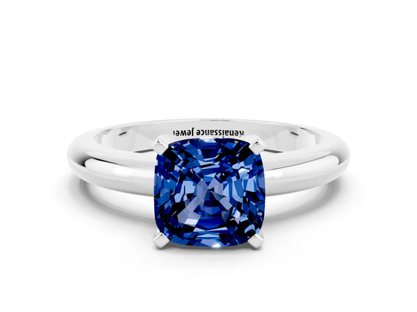 Platinum Cushion Cut Blue Sapphire Solitaire Engagement Ring with Round Band and Four-Prong Setting