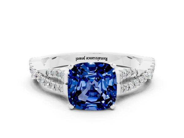 Platinum Cushion Cut Blue Sapphire Solitaire Engagement Ring with Twisted Pavé Band and Four-Prong Setting