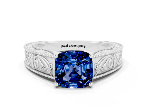 White gold Cushion Cut Blue Sapphire Solitaire Ring with Engraved Band and Four-Prong Setting