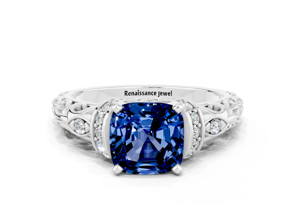 Platinum Cushion Cut Blue Sapphire Solitaire Ring with Filigree Band and Four-Prong Setting