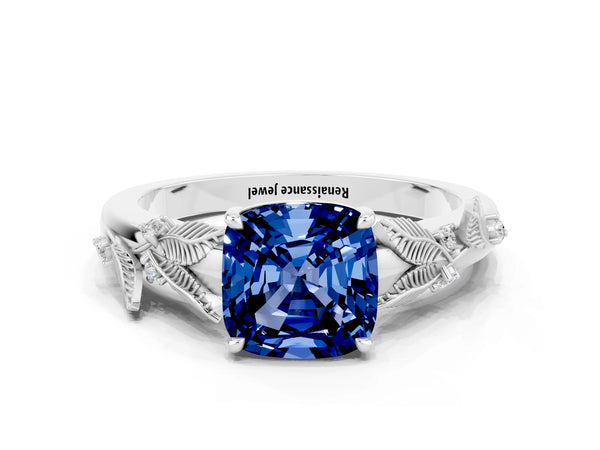 Platinum Cushion Cut Blue Sapphire Solitaire Ring with Leaf Motif Band and Four-Prong Setting