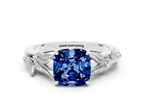 Silver Cushion Cut Blue Sapphire Solitaire Ring with Leaf Motif Band and Four-Prong Setting