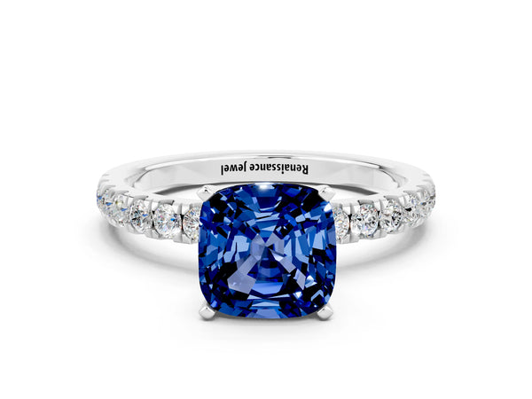 Platinum Cushion Cut Blue Sapphire Solitaire Ring with Pavé Accents and Four-Prong Setting