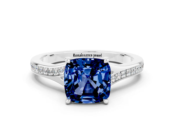 Platinum Cushion Cut Blue Sapphire Solitaire Ring with Pavé Band and Prong Setting