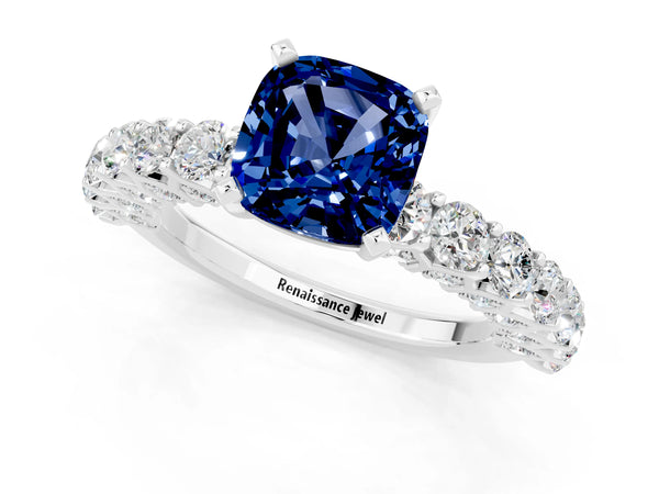 Silver Cushion Cut Blue Sapphire Solitaire Ring with Shared Prong Pavé Band and Four-Prong Setting