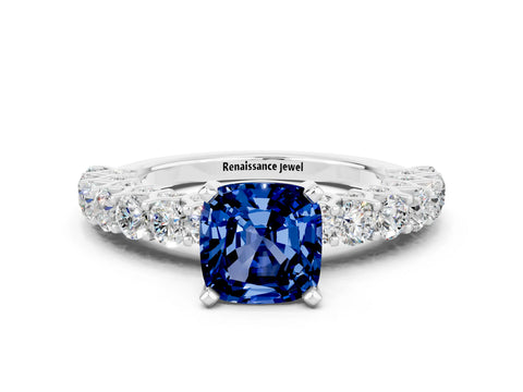 White gold Cushion Cut Blue Sapphire Solitaire Ring with Shared Prong Pavé Band and Four-Prong Setting