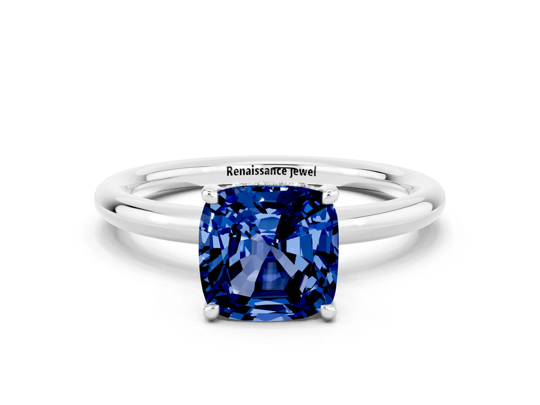 White gold Cushion Cut Blue Sapphire Solitaire Ring with Thin Band and Four-Prong Setting