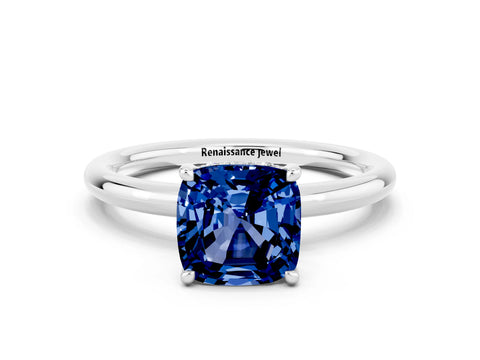 White gold Cushion Cut Blue Sapphire Solitaire Ring with Thin Band and Four-Prong Setting