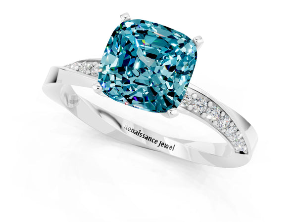 Silver Cushion Cut Blue Topaz Engagement Ring with Side Stone Accents and Four-Prong Setting