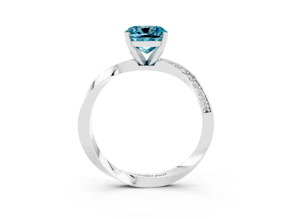 Platinum Cushion Cut Blue Topaz Engagement Ring with Side Stone Accents and Four-Prong Setting