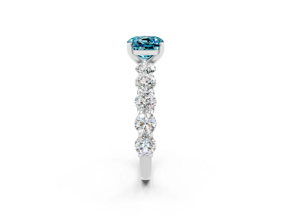 Silver Cushion Cut Blue Topaz Prong Setting with Side Stones on a Pave Band