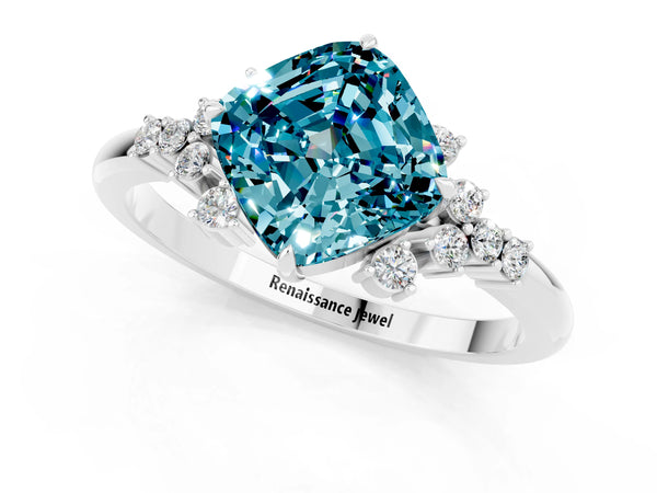 Platinum Cushion Cut Blue Topaz Ring with Side Stones and Four-Prong Setting