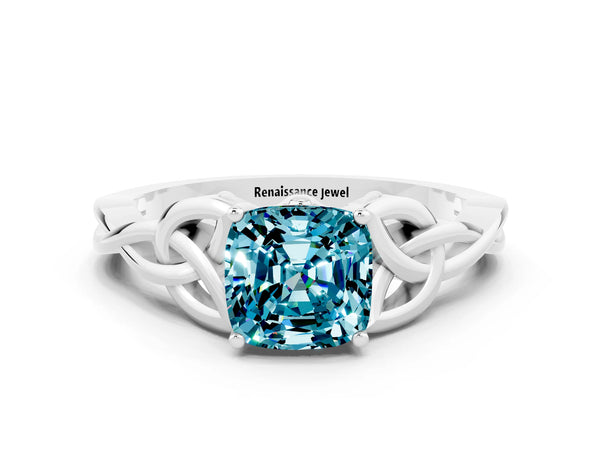 Silver Cushion Cut Blue Topaz Solitaire Engagement Ring with Celtic Knot Band and Four-Prong Setting