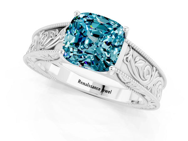 Silver Cushion Cut Blue Topaz Solitaire Ring with Engraved Band and Four-Prong Setting