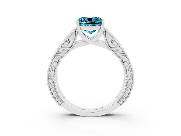 Platinum Cushion Cut Blue Topaz Solitaire Ring with Engraved Band and Four-Prong Setting