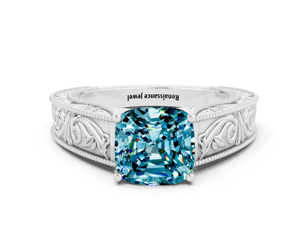 White gold Cushion Cut Blue Topaz Solitaire Ring with Engraved Band and Four-Prong Setting