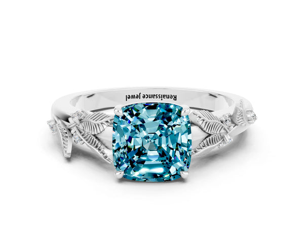Silver Cushion Cut Blue Topaz Solitaire Ring with Leaf Motif Band and Four-Prong Setting