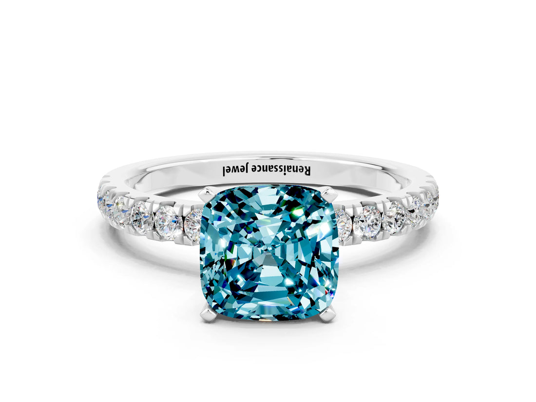 White gold Cushion Cut Blue Topaz Solitaire Ring with Pavé Accents and Four-Prong Setting