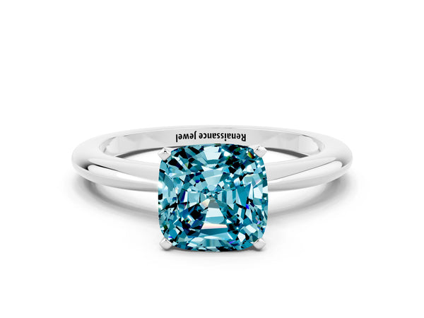 Platinum Cushion Cut Blue Topaz Solitaire Ring with Six-Prong Setting and Classic Band