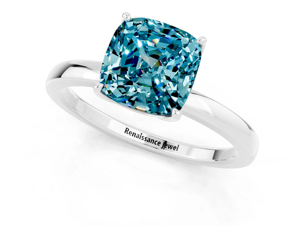 Platinum Cushion Cut Blue Topaz Solitaire Ring with Thin Band and Prong Setting