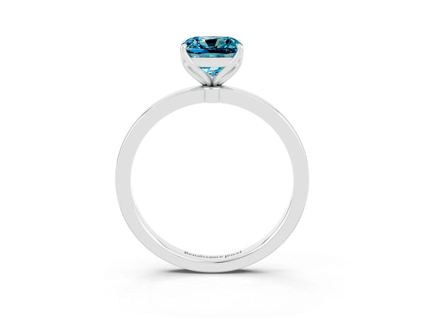 Platinum Cushion Cut Blue Topaz Solitaire Ring with Thin Band and Prong Setting