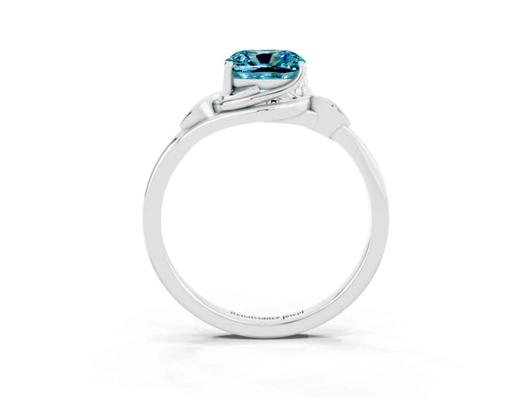 Silver Cushion Cut Blue Topaz Solitaire Ring with Twist Band and Four-Prong Setting