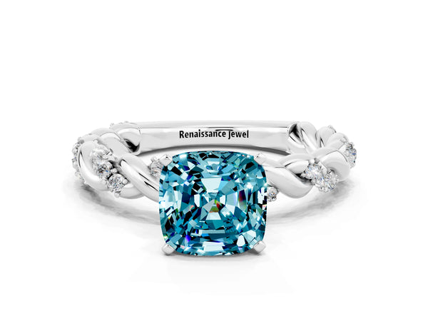 Platinum Cushion Cut Blue Topaz Solitaire Ring with Twisted Band and Pavé Accents