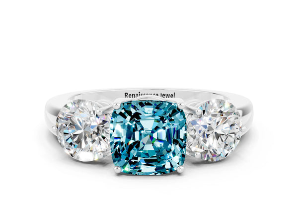 Platinum Cushion Cut Blue Topaz Three-Stone Ring with Prong Setting and Classic Band