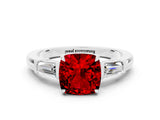 White gold Cushion Cut Cut Diamond Ring with Tapered Baguette Side Stones in Four-Prong Setting
