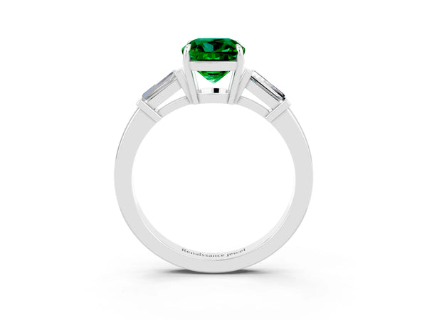 Platinum Cushion Cut Emerald Three-Stone Ring with Tapered Baguette Side Stones and Prong Setting
