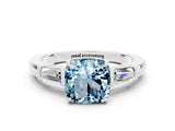White gold Cushion Cut Cut Diamond Ring with Tapered Baguette Side Stones in Four-Prong Setting