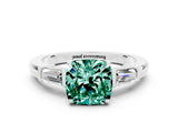White gold Cushion Cut Cut Diamond Ring with Tapered Baguette Side Stones in Four-Prong Setting