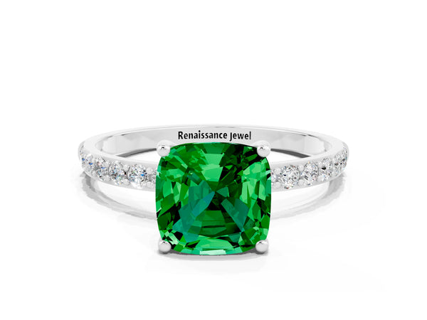 Platinum Cushion Cut Emerald Solitaire Ring with Round Pavé Shoulders and Prong Setting