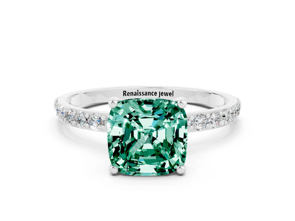 Platinum Cushion Cut Green Sapphire Solitaire Ring with Round Pavé Shoulders and Prong Setting