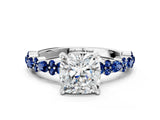 White gold Cushion Cut Diamond Side Stone Solitaire Ring with Round with Blue Sapphire side stone and Four-Prong Setting