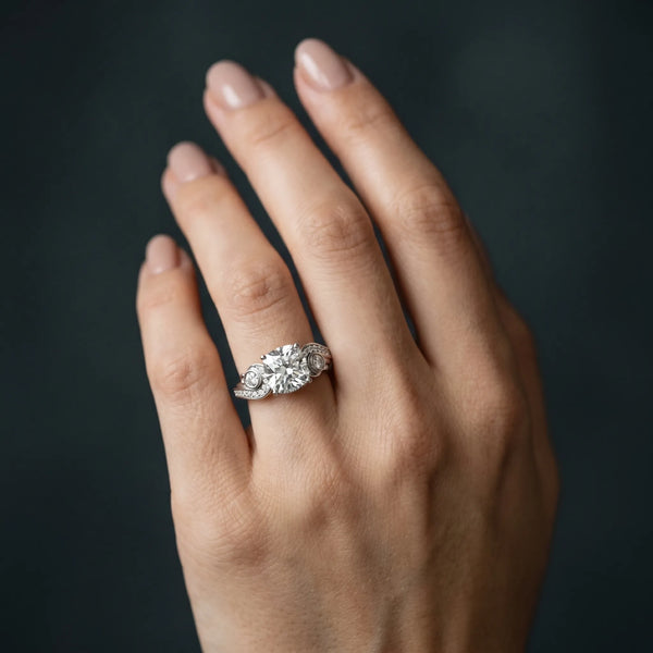 White gold Cushion Cut Diamond Solitaire Ring with Milgrain Pavé Band and Four-Prong Setting