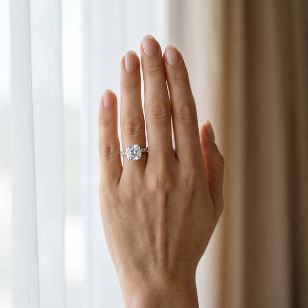 White gold Cushion Cut Diamond Solitaire Ring with Pavé Accents and Four-Prong Setting