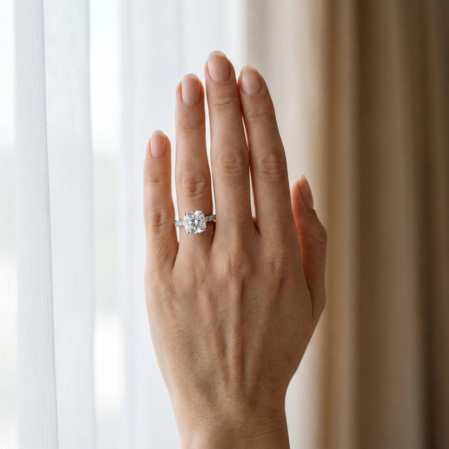White gold Cushion Cut Diamond Solitaire Ring with Pavé Accents and Four-Prong Setting