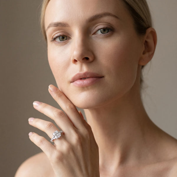 White gold Cushion Cut Diamond Solitaire Ring with Side Stones and Four-Prong Setting