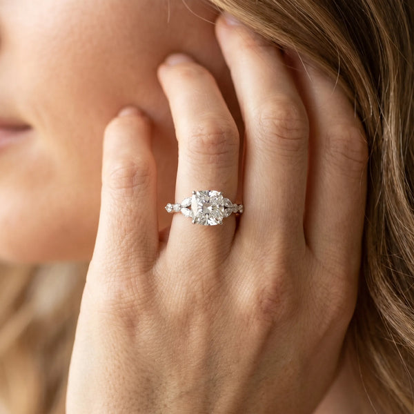 White gold Cushion Cut Diamond Solitaire Ring with Side Stones and Four-Prong Setting