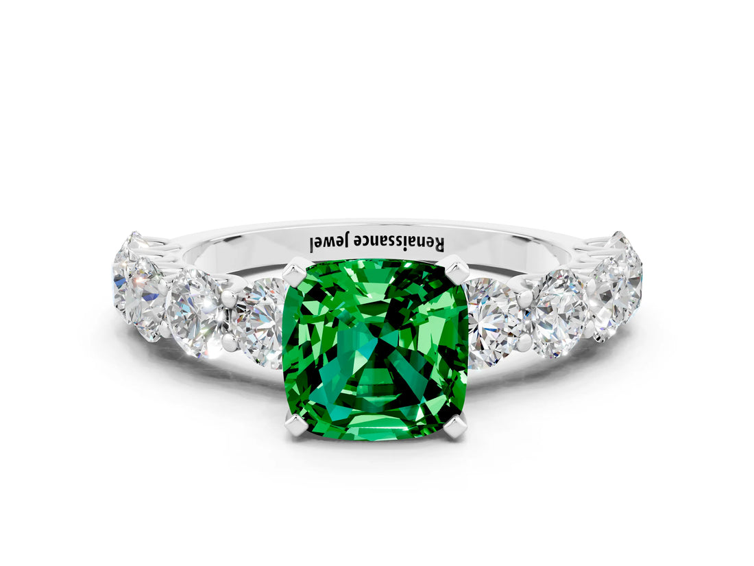 White gold Cushion Cut Emerald Prong Setting with Side Stones on a Pave Band