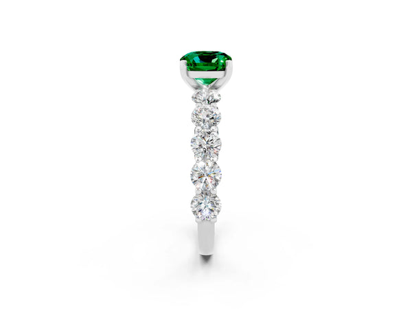 White gold Cushion Cut Emerald Prong Setting with Side Stones on a Pave Band