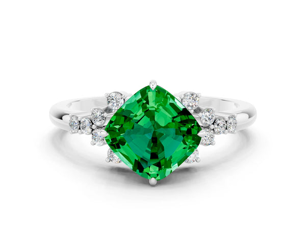 Silver Cushion Cut Emerald Ring with Side Stones and Four-Prong Setting