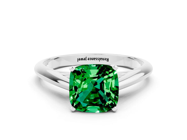 Platinum Cushion Cut Emerald Solitaire Engagement Ring with Cathedral Setting and Four-Prong Mount